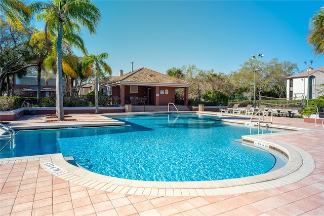 view of swimming pool with a patio area