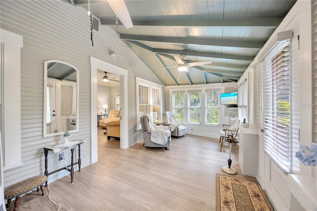 sunroom featuring wooden ceiling, ceiling fan, and vaulted ceiling with beams