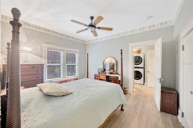 bedroom with ceiling fan, ornamental molding, light hardwood / wood-style floors, and stacked washer / dryer