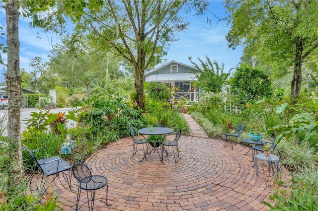 view of patio / terrace featuring a sunroom