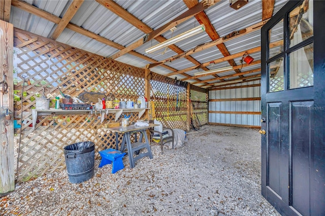 interior space featuring vaulted ceiling with beams