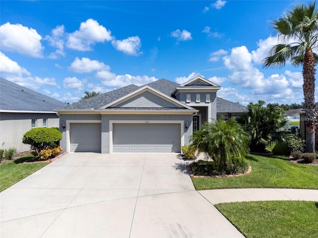 view of front of house with a garage and a front yard