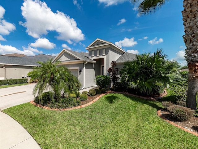 view of front facade featuring a garage and a front yard