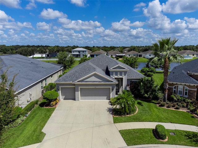 view of front of house featuring a garage and a front lawn