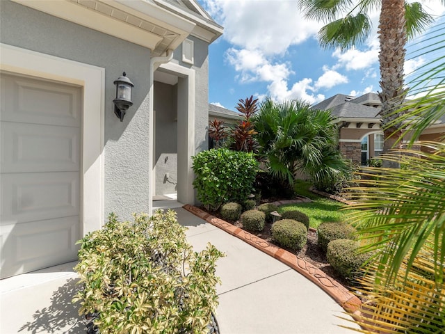 doorway to property featuring a garage