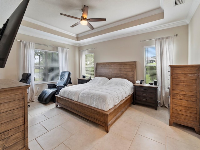 bedroom with ornamental molding, a raised ceiling, light tile patterned floors, and ceiling fan