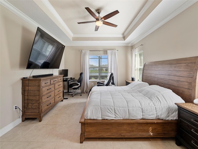 tiled bedroom with ceiling fan, ornamental molding, and a tray ceiling