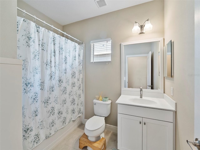 full bathroom with shower / bath combo with shower curtain, tile patterned flooring, toilet, and vanity