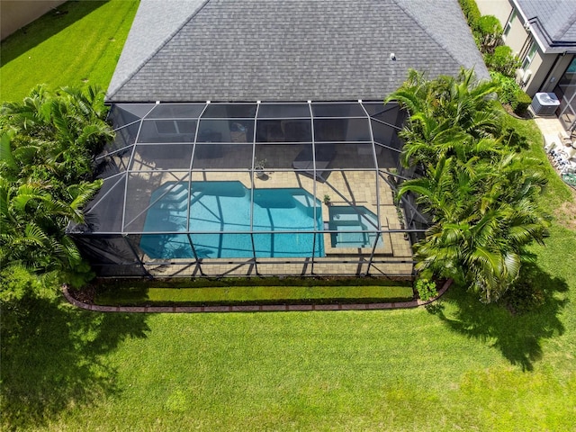 view of pool featuring a yard and a lanai