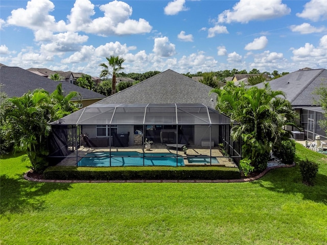 view of swimming pool featuring glass enclosure and a yard