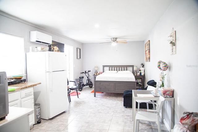 bedroom featuring white refrigerator, ceiling fan, a wall unit AC, and light tile patterned flooring