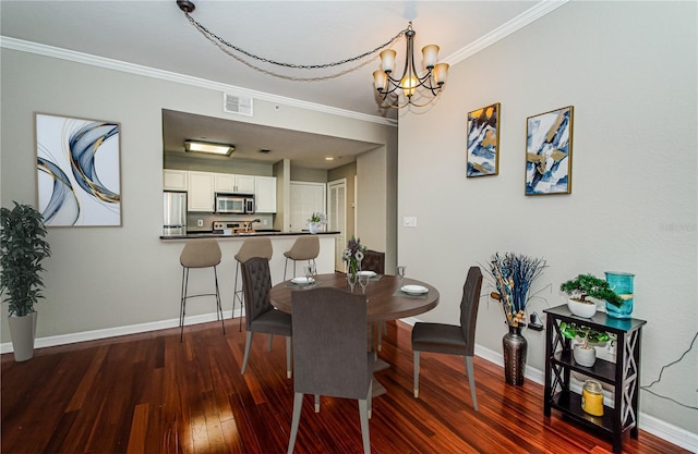 dining space with an inviting chandelier, crown molding, and dark wood-type flooring