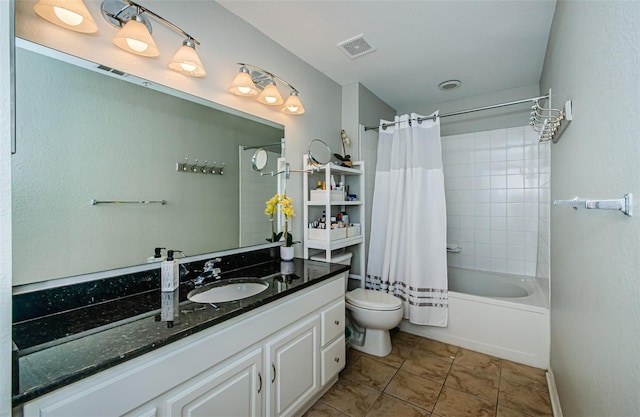 full bathroom with shower / tub combo, tile patterned flooring, vanity, and toilet