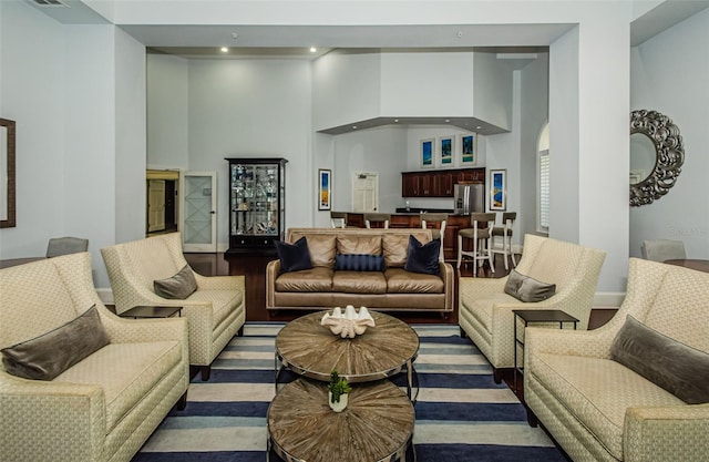 living room with a towering ceiling