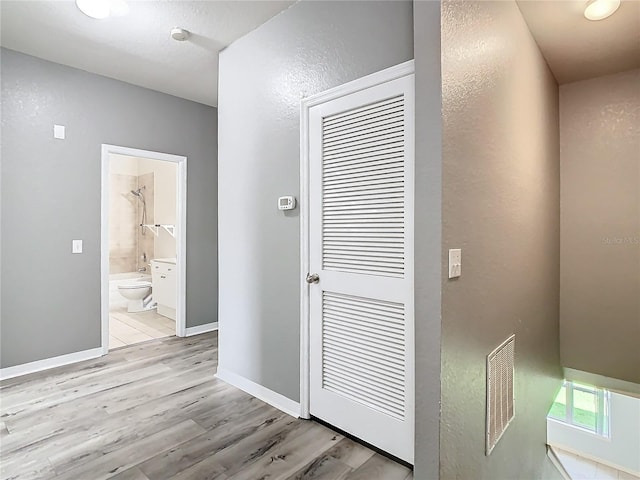 hallway featuring light hardwood / wood-style flooring