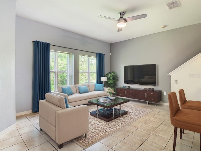 living room with light tile patterned floors and ceiling fan