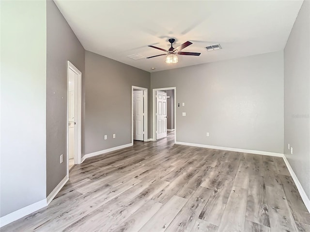 unfurnished room with ceiling fan and light hardwood / wood-style flooring