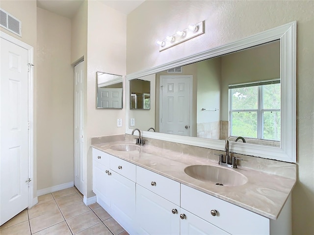 bathroom featuring tile patterned floors and vanity