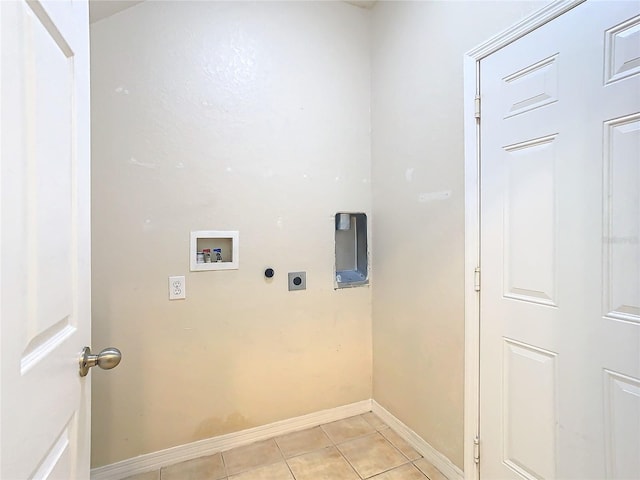 clothes washing area featuring washer hookup, electric dryer hookup, and light tile patterned flooring