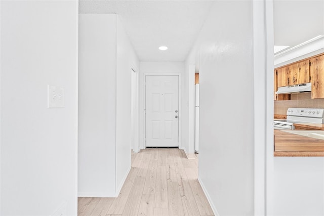 corridor featuring light hardwood / wood-style flooring