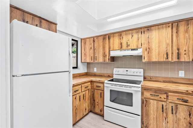 kitchen featuring tasteful backsplash, butcher block counters, white appliances, and light hardwood / wood-style floors