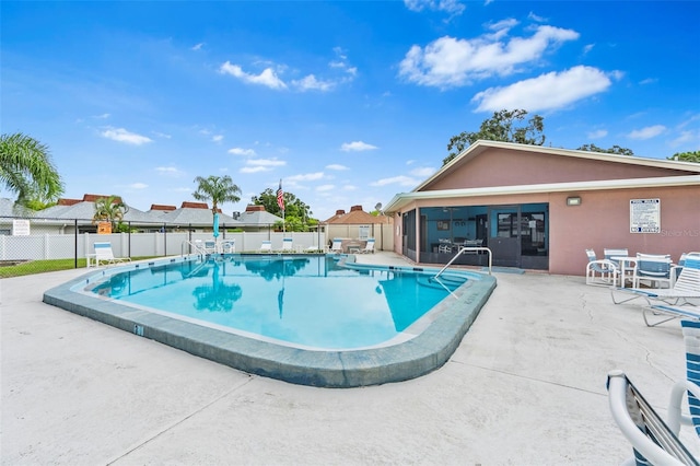 view of swimming pool featuring a patio