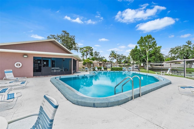 view of pool featuring a patio area