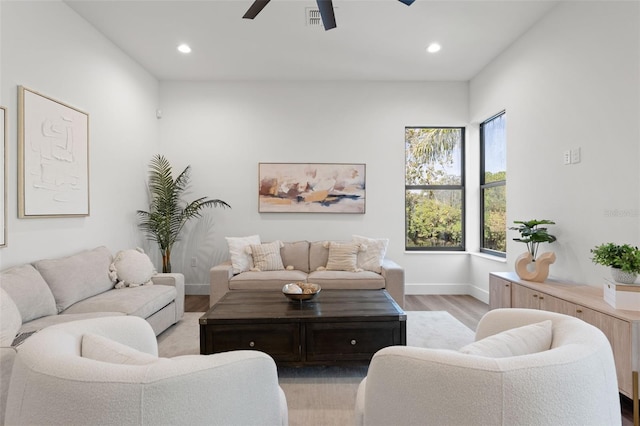 living room with ceiling fan, baseboards, wood finished floors, and recessed lighting