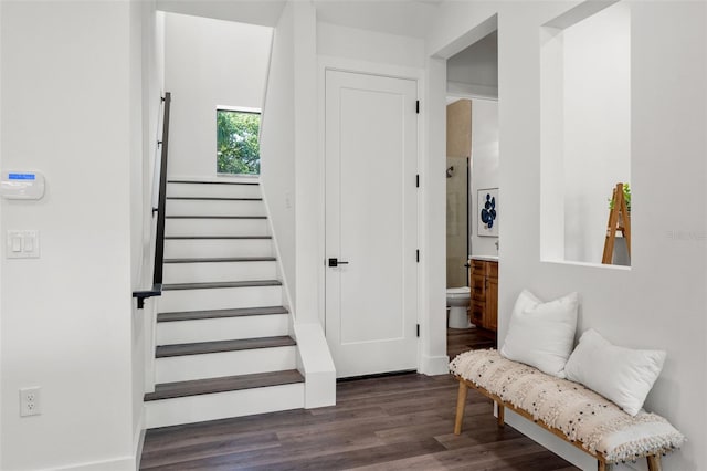 stairs with wood finished floors