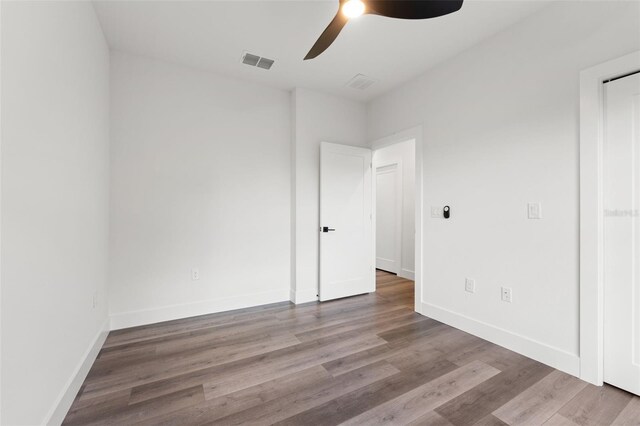 empty room with light wood-type flooring and ceiling fan