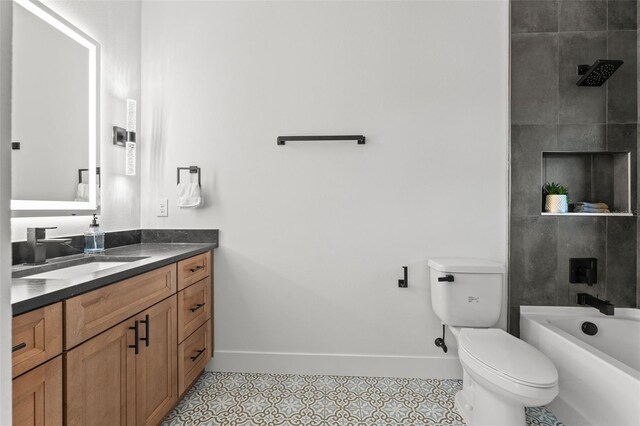 full bathroom with toilet, vanity, tile patterned floors, and tiled shower / bath