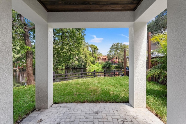 view of patio featuring fence