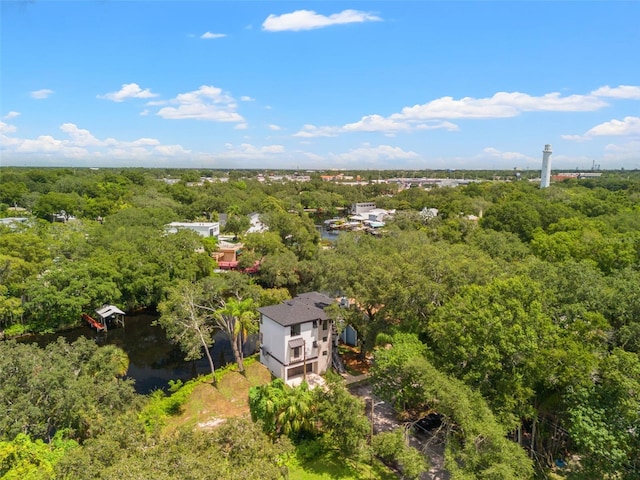 bird's eye view featuring a wooded view