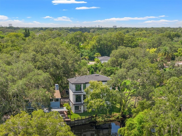 drone / aerial view featuring a forest view