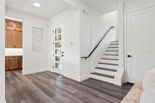 entrance foyer with dark hardwood / wood-style floors