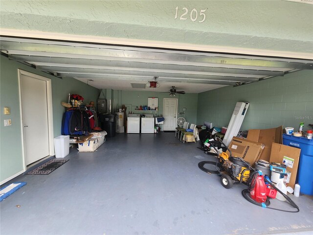 garage with separate washer and dryer, water heater, a garage door opener, and ceiling fan