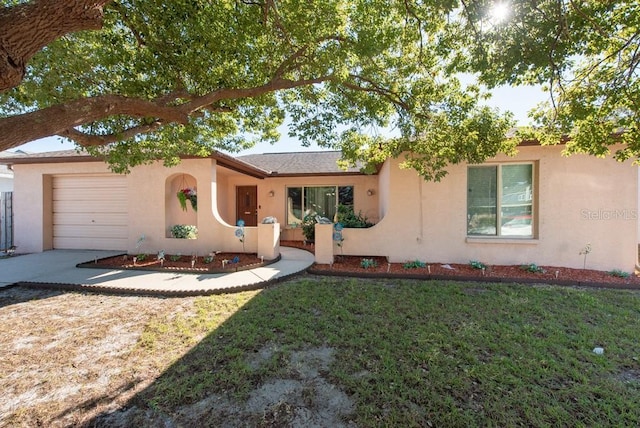 view of front facade with a front lawn and a garage