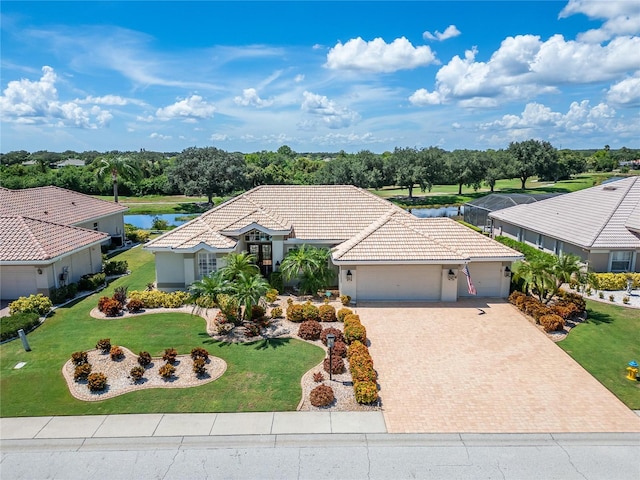 single story home with a water view and a garage