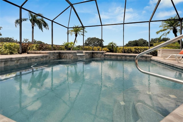 view of swimming pool featuring glass enclosure