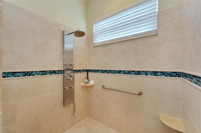 bathroom with a tile shower