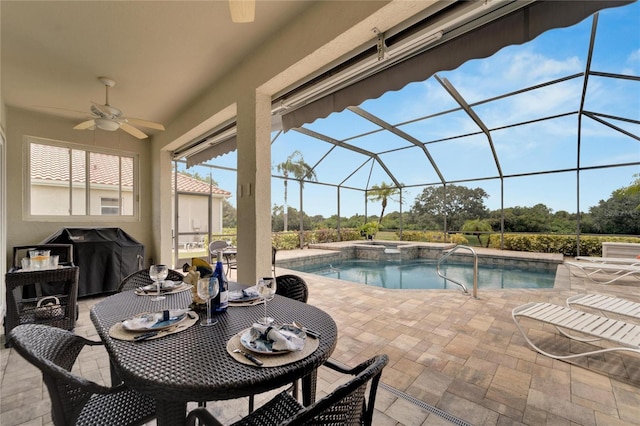 view of swimming pool with area for grilling, glass enclosure, ceiling fan, and a patio area