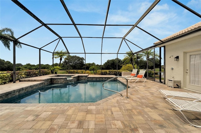 view of pool with a patio area, a lanai, and an in ground hot tub