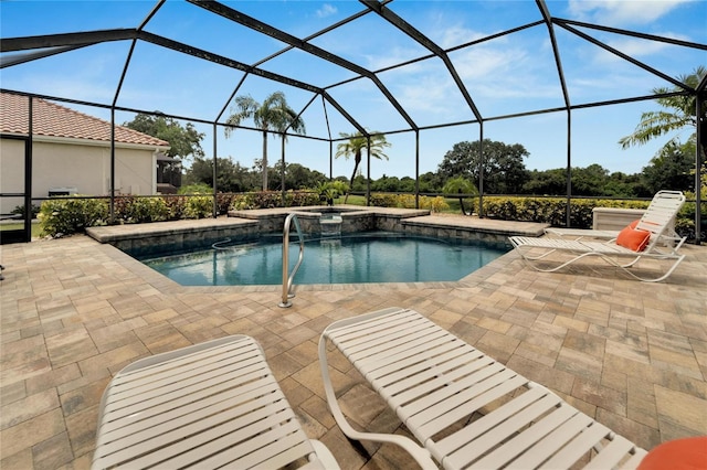 view of swimming pool with an in ground hot tub, a patio, and glass enclosure