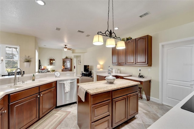 kitchen with ceiling fan with notable chandelier, sink, light tile patterned floors, decorative light fixtures, and dishwasher