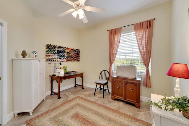 office space with ceiling fan and light tile patterned flooring