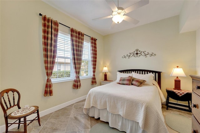 tiled bedroom with ceiling fan