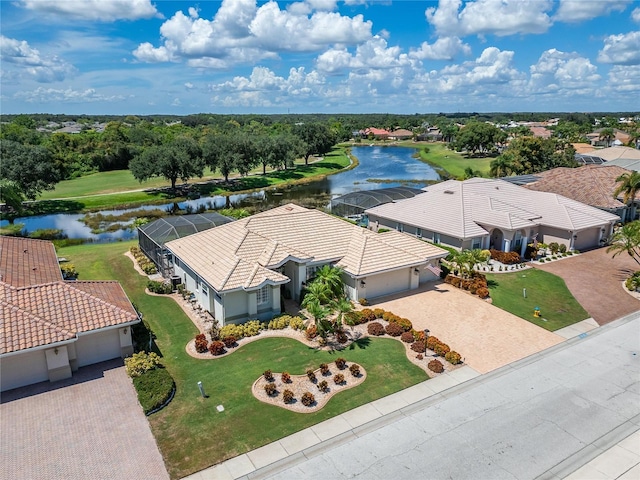 birds eye view of property with a water view