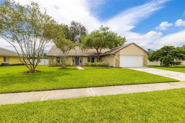 ranch-style house with stucco siding, an attached garage, stone siding, driveway, and a front lawn