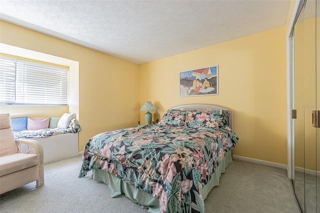 bedroom featuring a textured ceiling, light colored carpet, and a closet