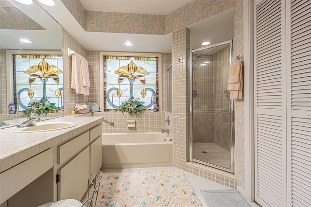 bathroom with vanity, separate shower and tub, and tile patterned flooring